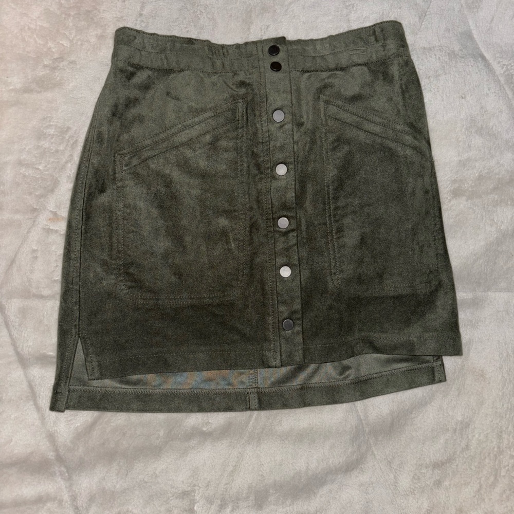 body tight skirt. buttons down the middle. fake pockets